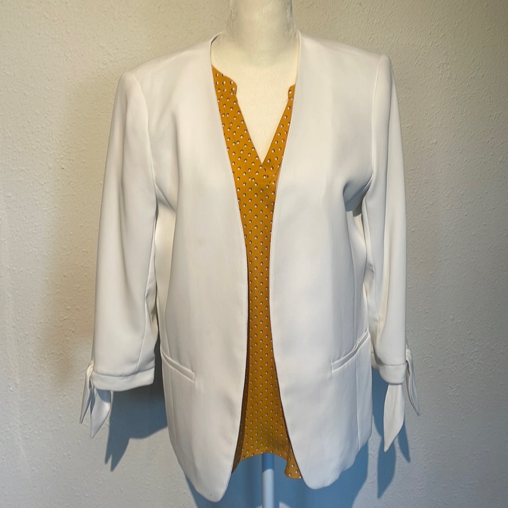 CeCe white blazer.
